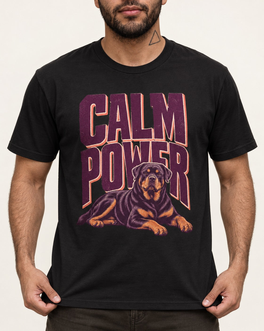 Rottweiler Calm Power Resting Dog Graphic T-Shirt in Black, worn by a model, front view