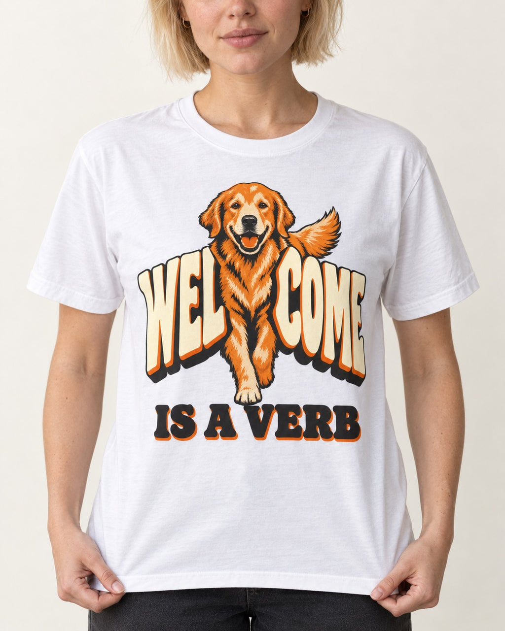 Golden Retriever Welcome Is a Verb T-Shirt in White, worn by a model, front view