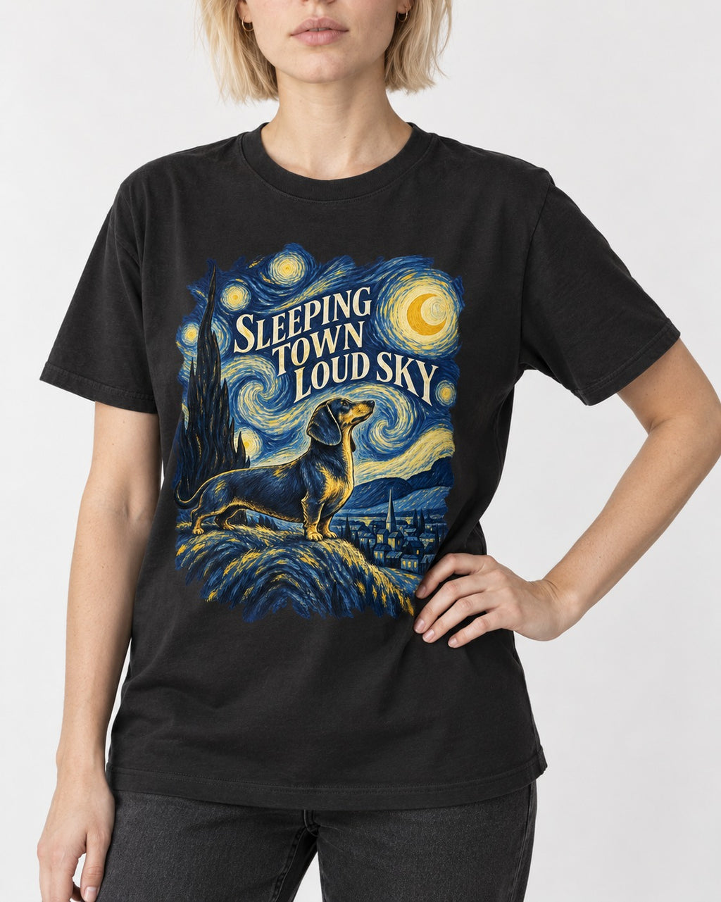 Dachshund Sleeping Town Loud Sky Starry Night Graphic T-Shirt in Black, worn by a model, front view