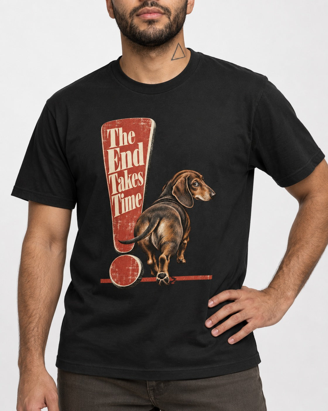 Dachshund The End Takes Time Exclamation Mark Graphic T-Shirt in Black, worn by a model, front view