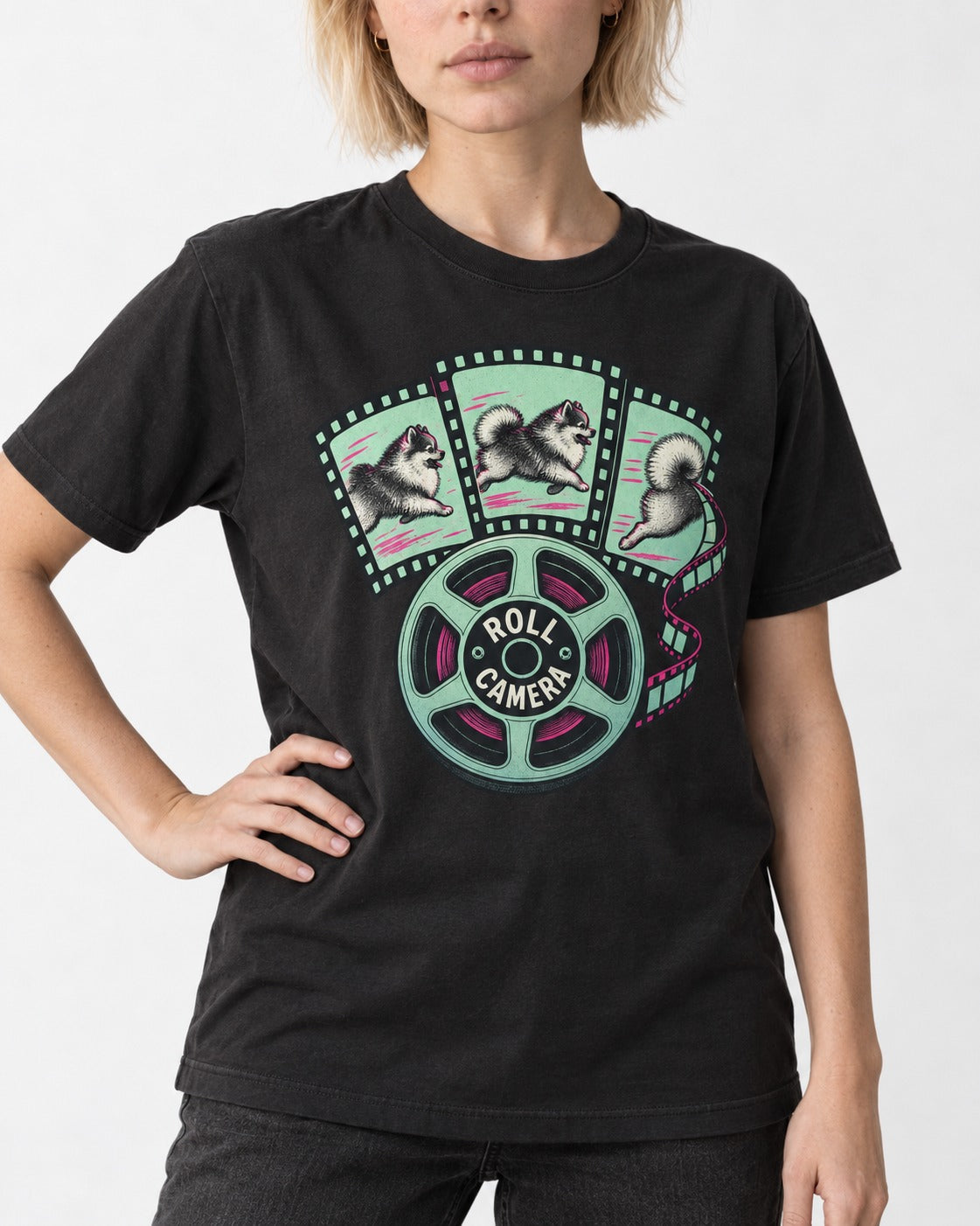 Pomeranian Roll Camera Film Reel Graphic T-Shirt in Black, worn by a model, front view