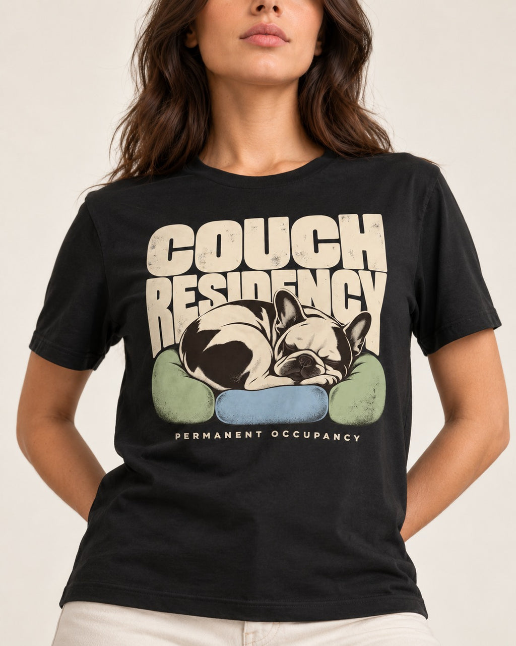 Frenchie Couch Residency Permanent Occupancy Cushion Graphic T-Shirt in Black, worn by a model, front view