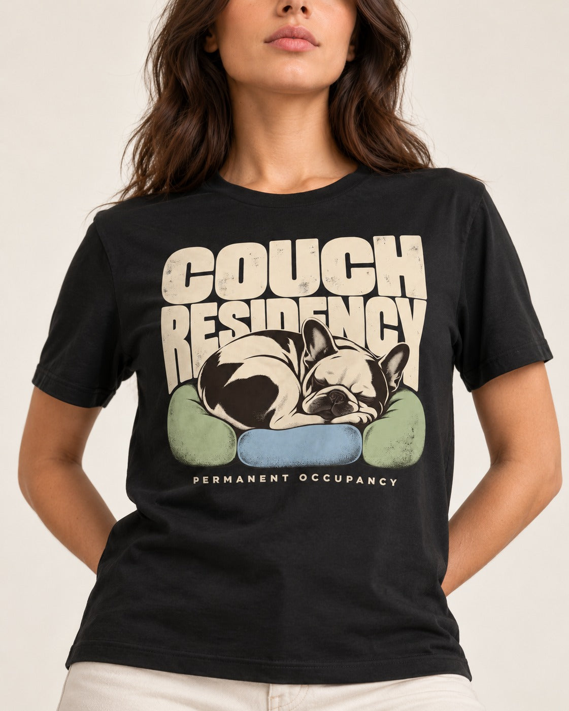 Frenchie Couch Residency Permanent Occupancy Cushion Graphic T-Shirt in Black, worn by a model, front view