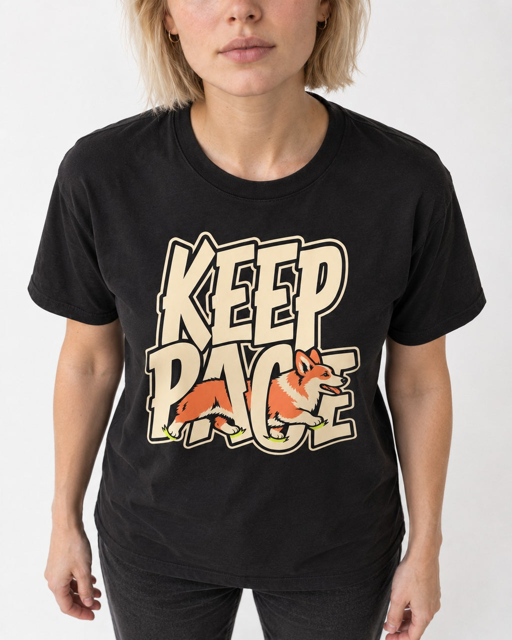 Corgi Keep Pace Running Typographic Graphic T-Shirt in Black, worn by a model, front view