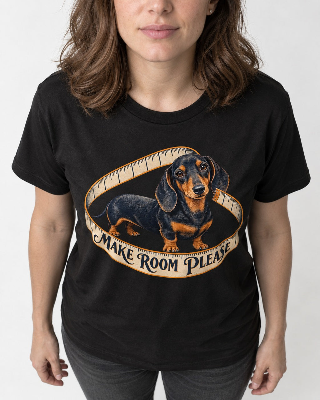 Dachshund Make Room Please Measuring Tape Graphic T-Shirt in Black, worn by a model, front view