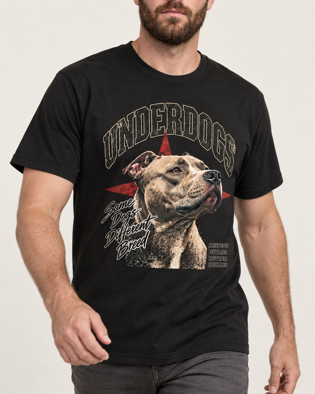 Pitbull Underdogs Same Dogs Different Breed Portrait Graphic T-Shirt in Black, worn by a model, front view