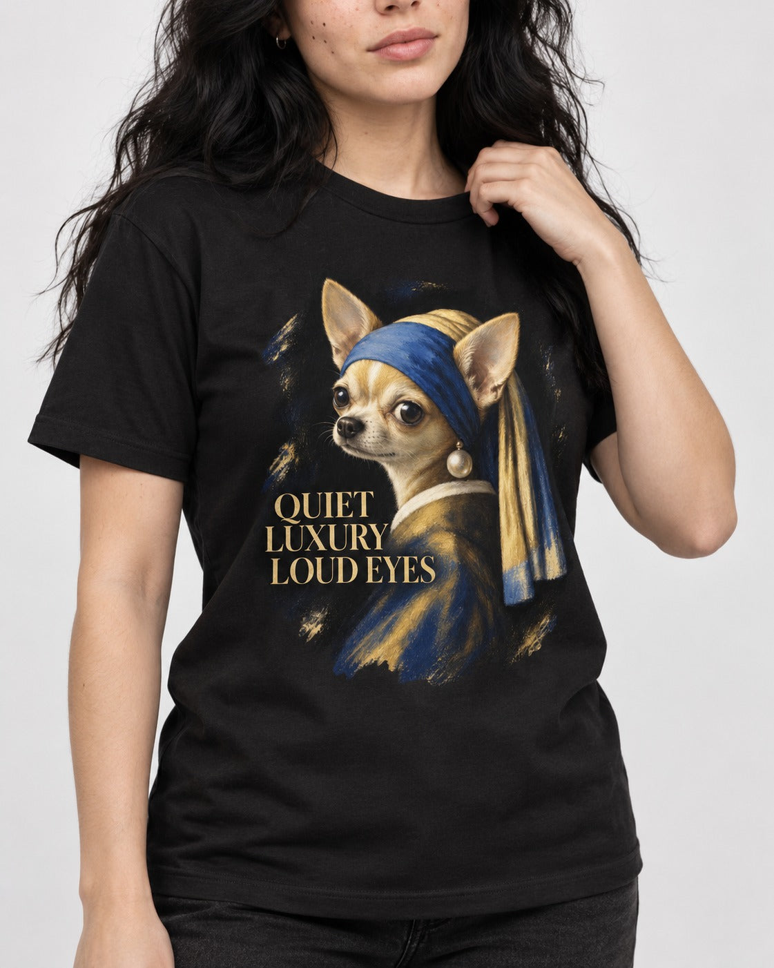 Chihuahua Quiet Luxury Loud Eyes Pearl Earring Portrait T-Shirt in Black, worn by a model, front view