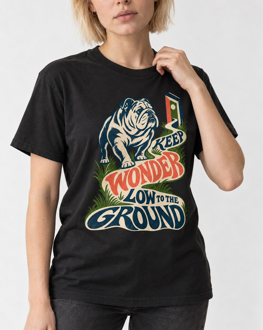 Keep Wonder Low to the Ground English Bulldog Graphic T-Shirt in Black, worn by a model, front view