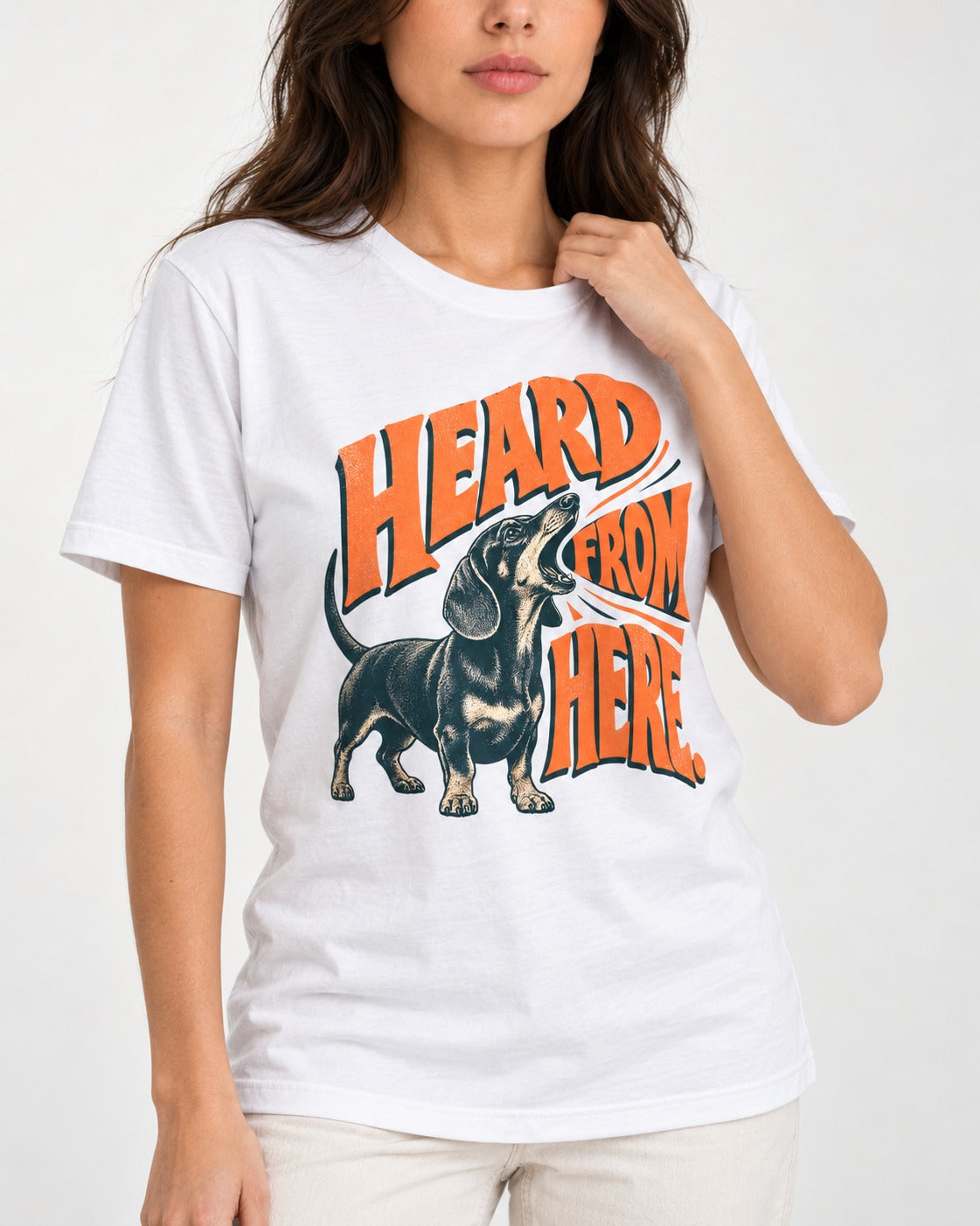Dachshund Heard From Here T-Shirt in White, worn by a model, front view