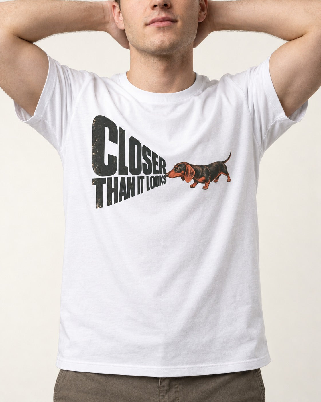 Dachshund Closer Than It Looks T-Shirt in White, worn by a model, front view