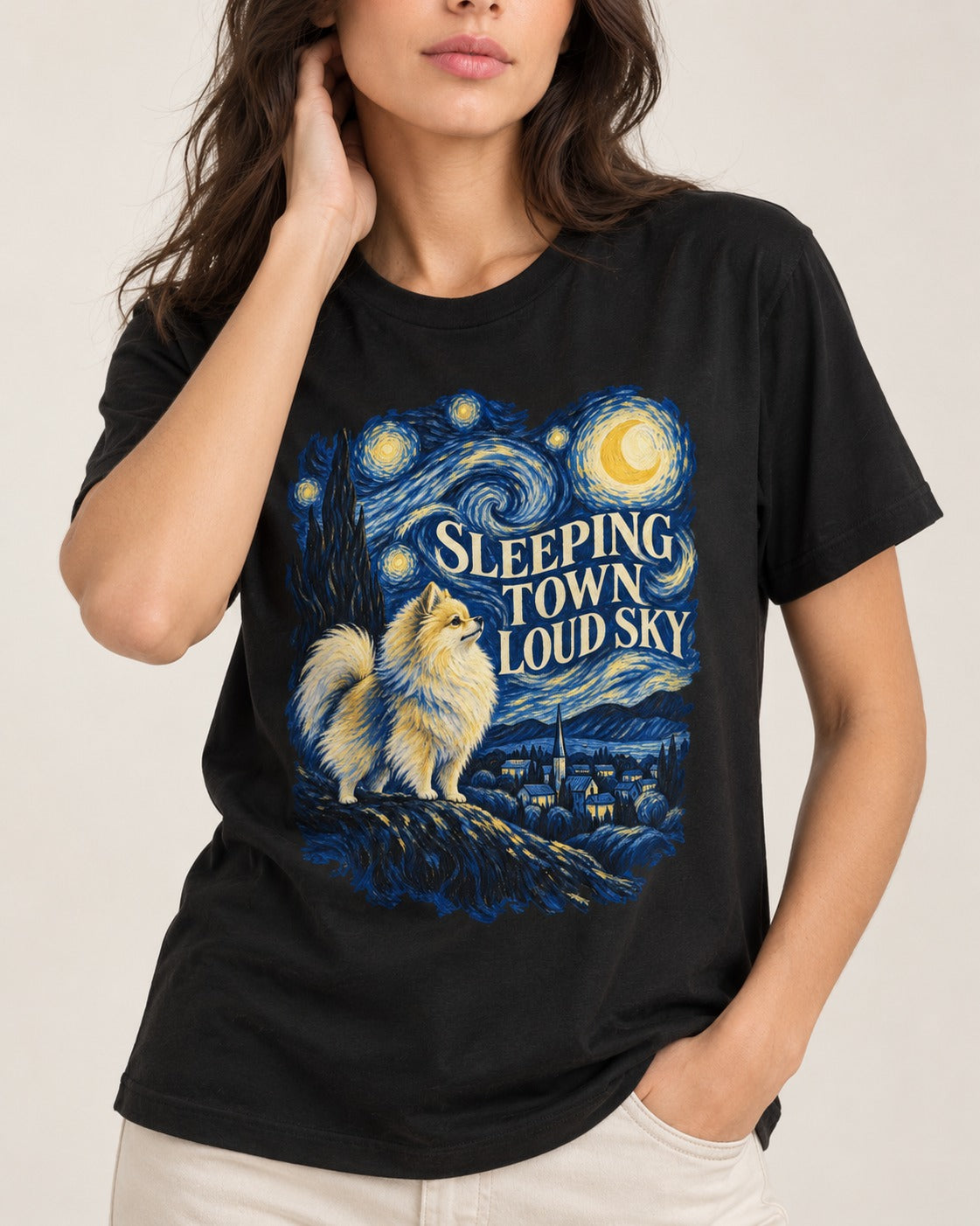 Pomeranian Sleeping Town Loud Sky Starry Night Graphic T-Shirt in Black, worn by a model, front view