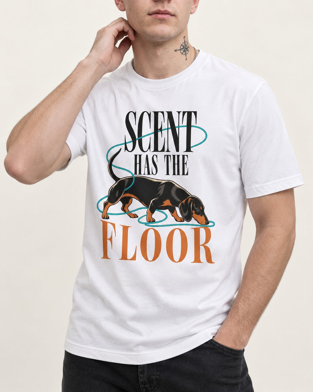 Dachshund Scent Has the Floor T-Shirt in White, worn by a model, front view