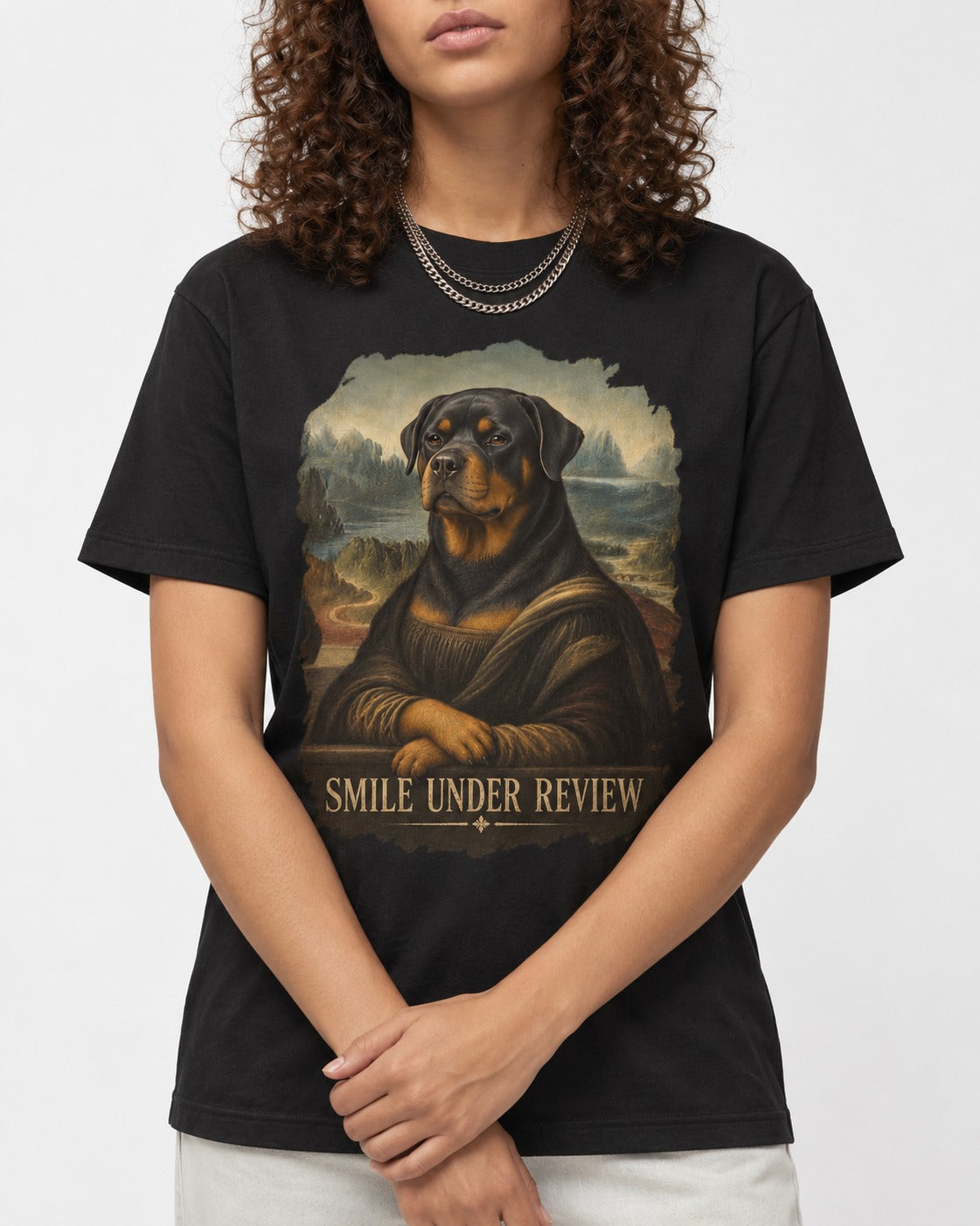 Rottweiler Smile Under Review Renaissance Portrait Graphic T-Shirt in Black, worn by a model, front view