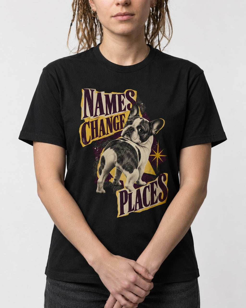 Frenchie Names Change Places Purple Poster Graphic T-Shirt in Black, worn by a model, front view