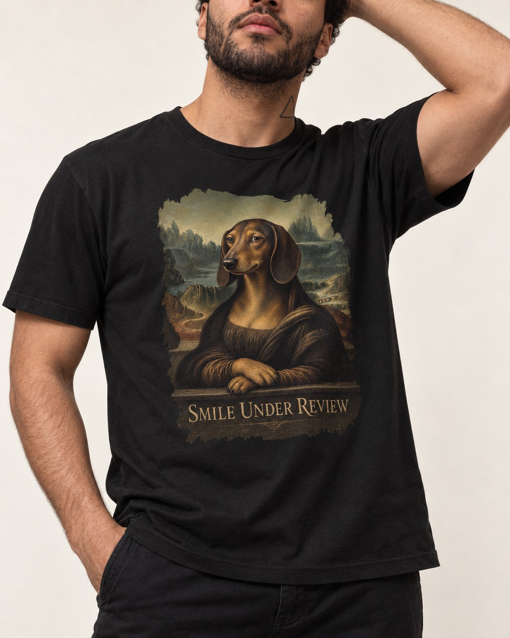 Dachshund Smile Under Review Mona Lisa Graphic T-Shirt in Black, worn by a model, front view