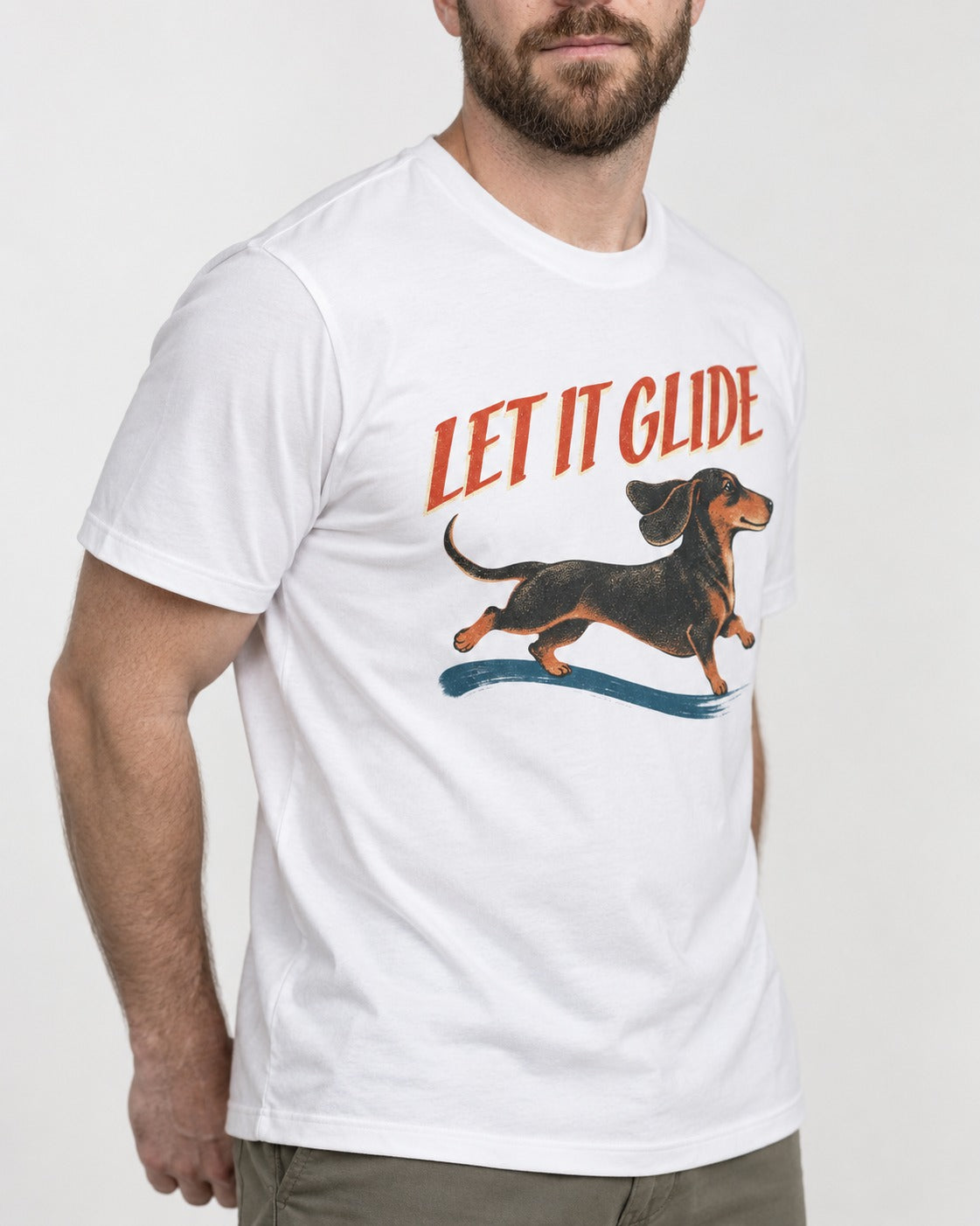 Let It Glide Dachshund T-Shirt in White, worn by a model, front view