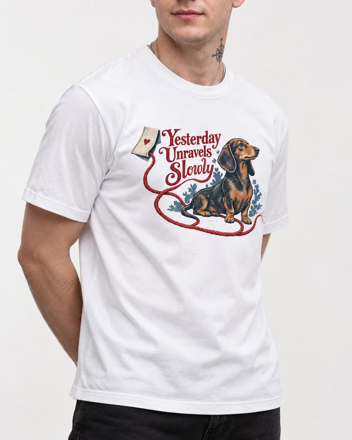 Yesterday Unravels Slowly with Dachshund T-Shirt in White, worn by a model, front view