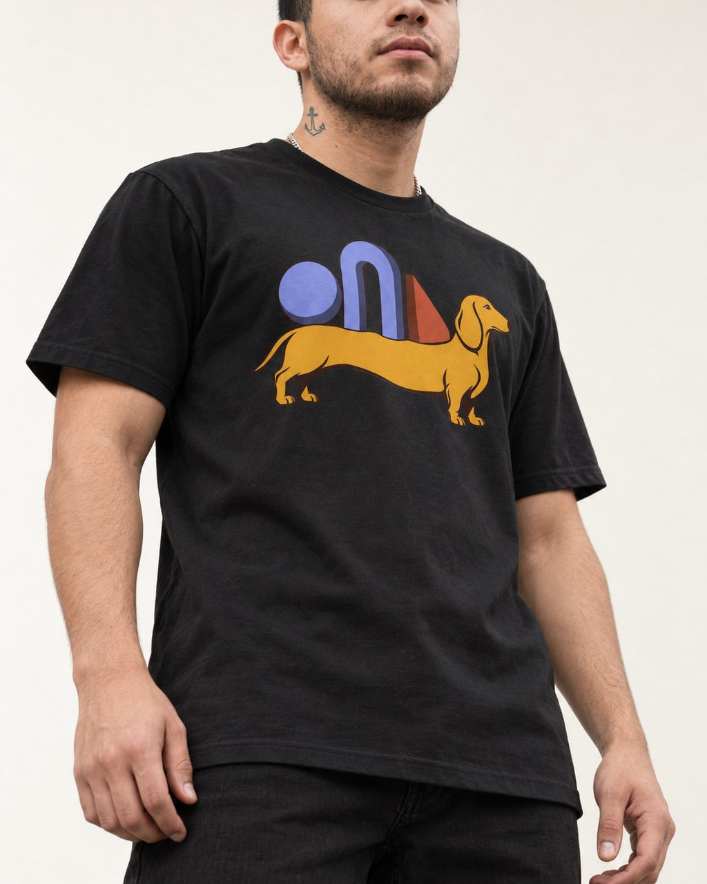 Dachshund Daydream T-Shirt in Black, worn by a model, front view