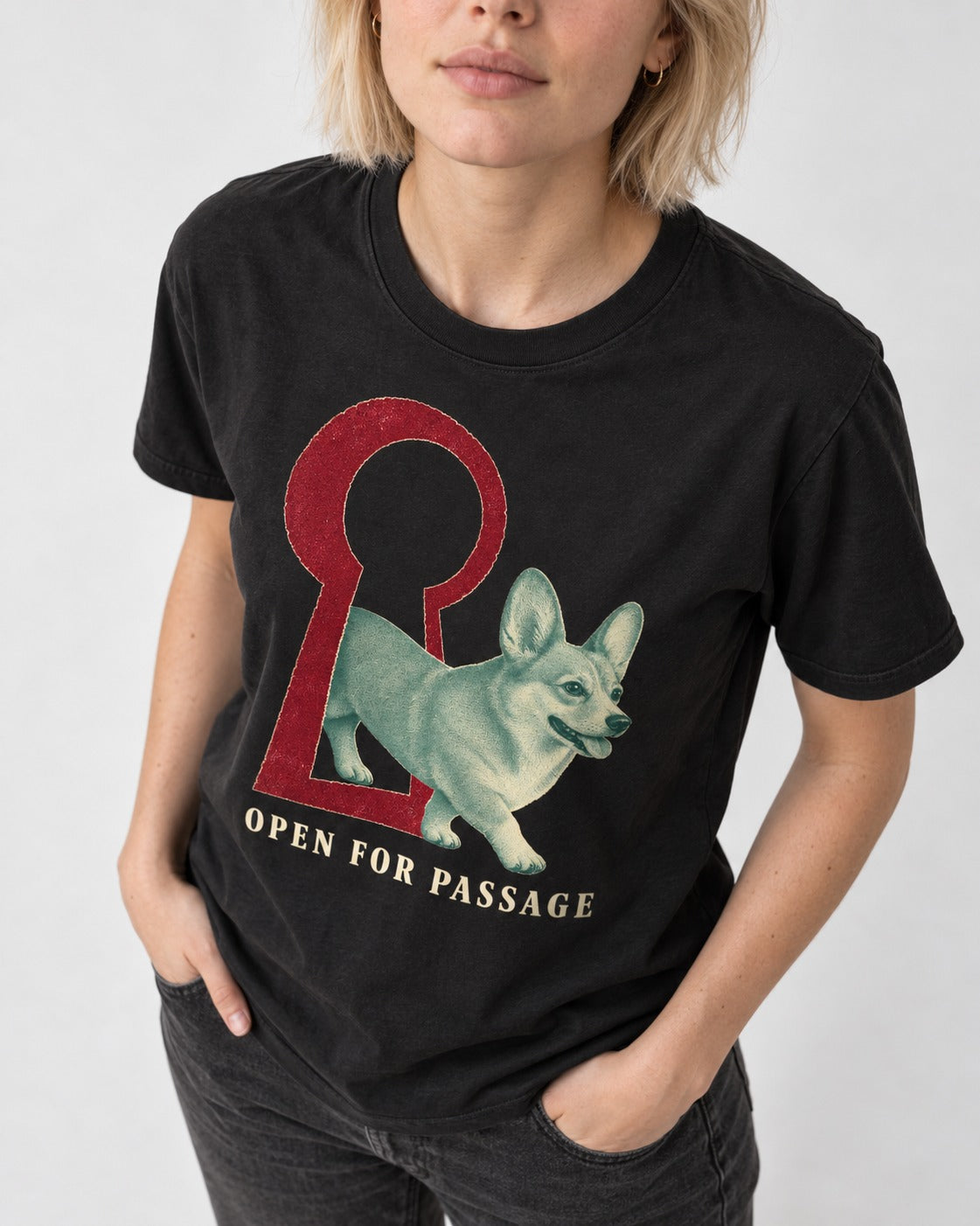 Corgi Open for Passage Keyhole Graphic T-Shirt in Black, worn by a model, front view