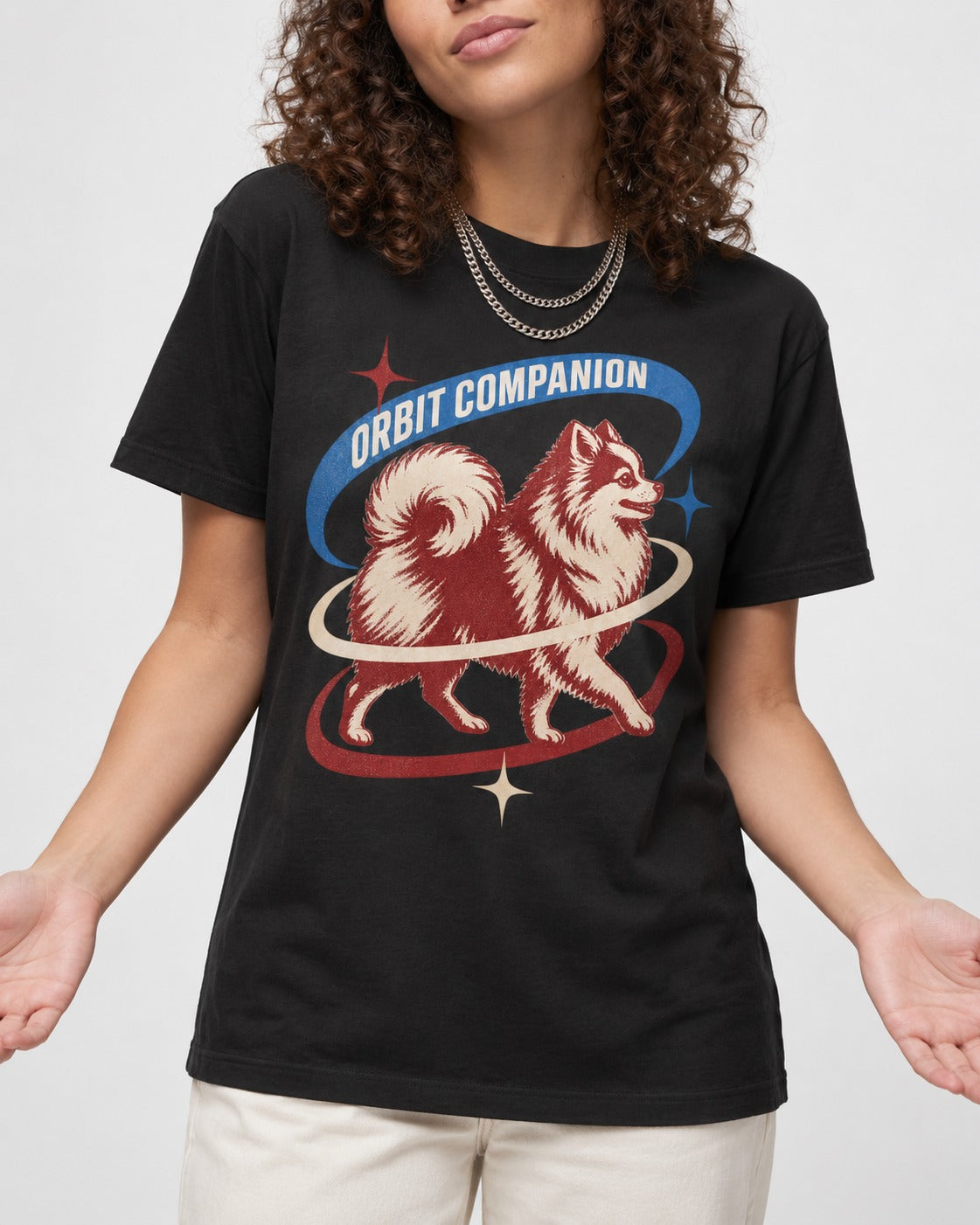 Pomeranian Orbit Companion Retro Space Graphic T-Shirt in Black, worn by a model, front view