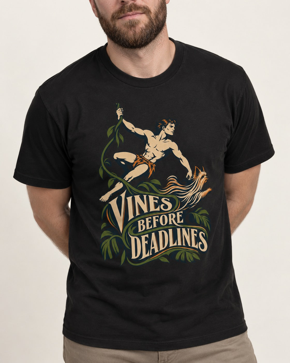 Yorkshire Terrier Vines Before Deadlines Jungle Hero Graphic T-Shirt in Black, worn by a model, front view