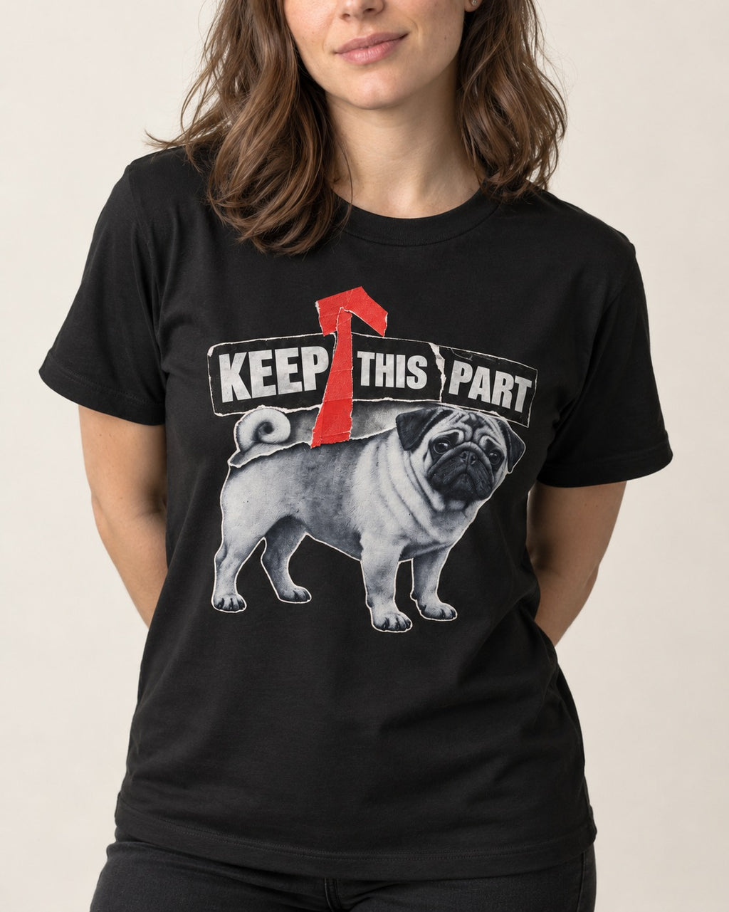 Pug Keep This Part Tape Arrow Graphic T-Shirt in Black, worn by a model, front view