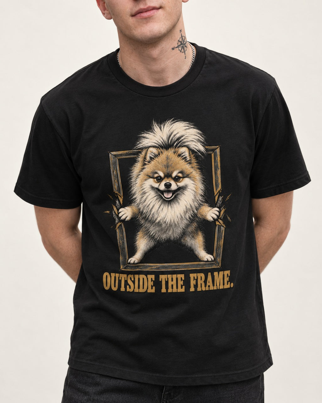 Pomeranian Outside the Frame Breakthrough Graphic T-Shirt in Black, worn by a model, front view
