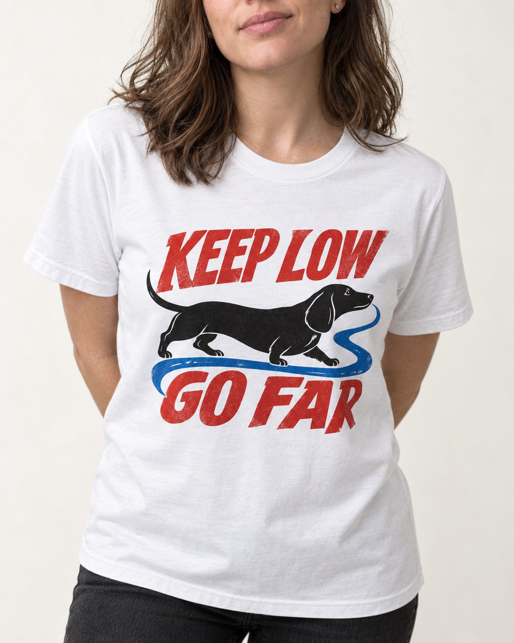 Keep Low Go Far Dachshund T-Shirt in White, worn by a model, front view