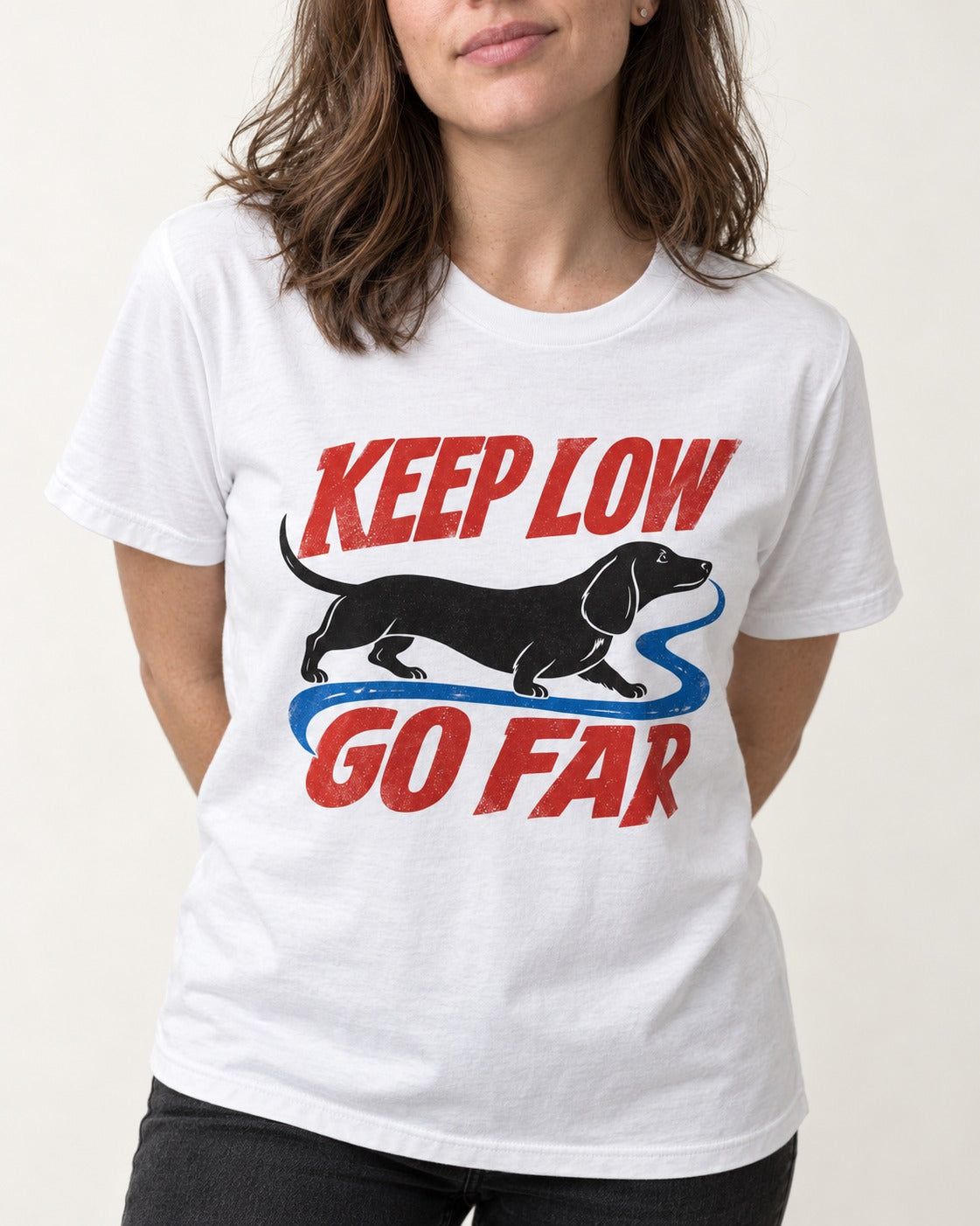 Keep Low Go Far Dachshund T-Shirt in White, worn by a model, front view