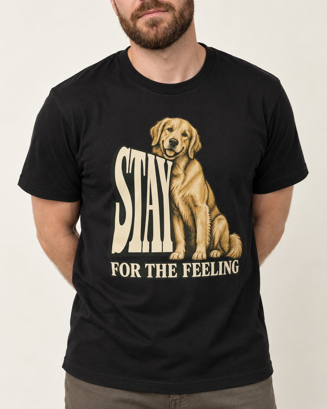 Golden Retriever Stay for the Feeling Leaning Puppy Graphic T-Shirt in Black, worn by a model, front view
