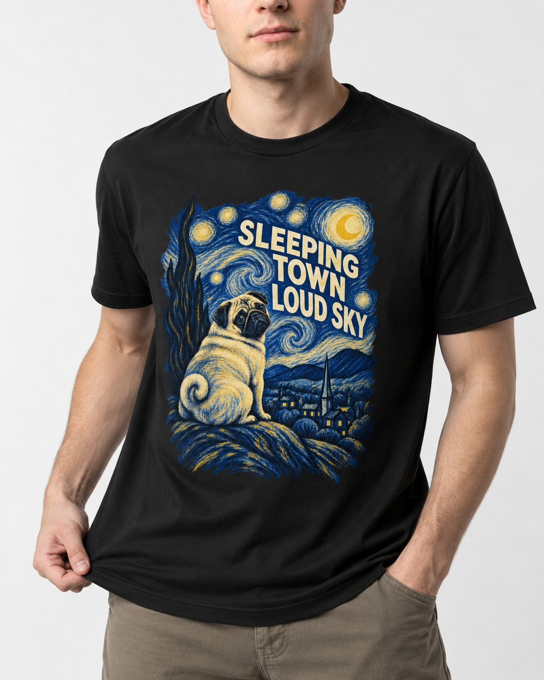 Pug Sleeping Town Loud Sky Starry Night Graphic T-Shirt in Black, worn by a model, front view