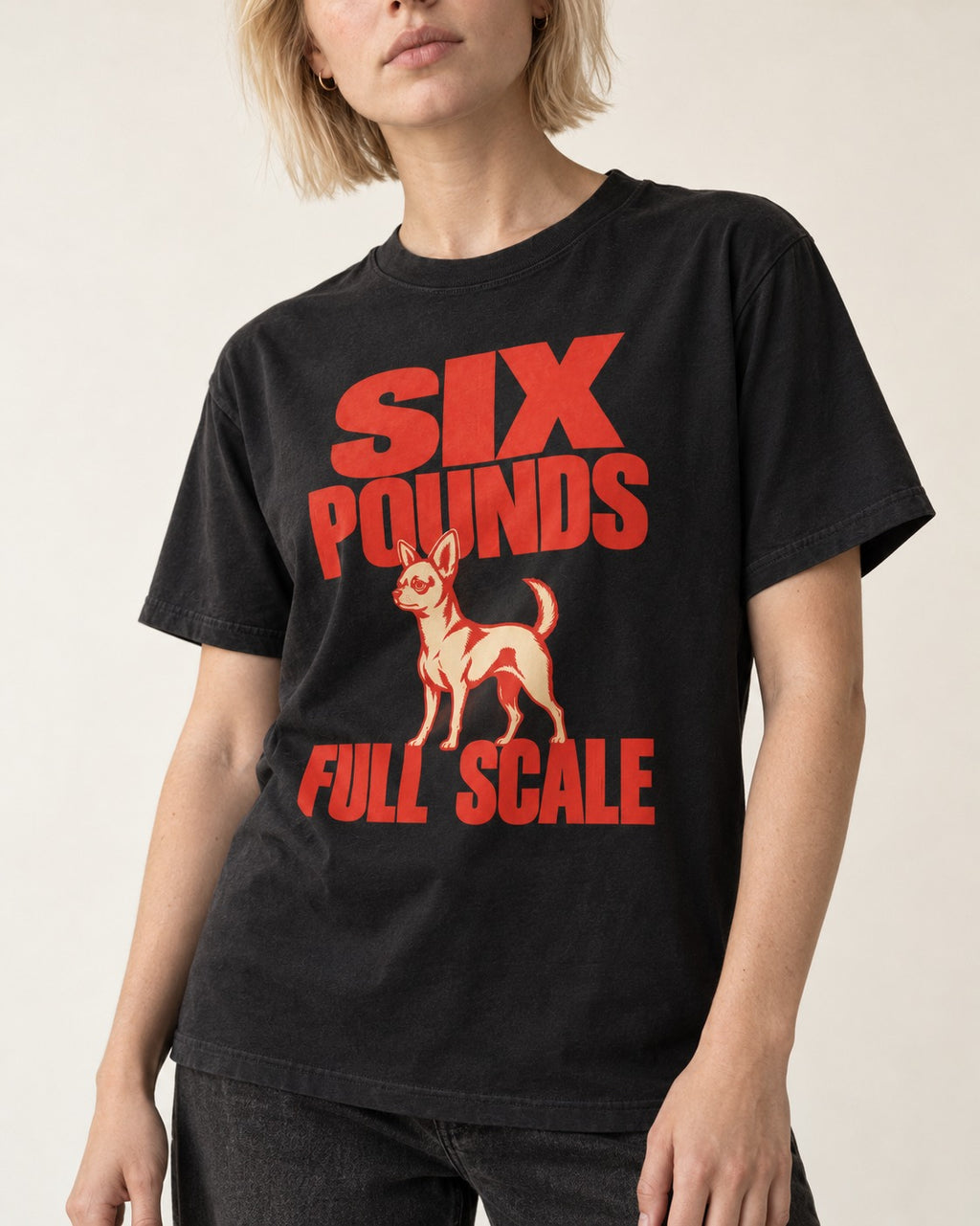 Chihuahua Six Pounds Full Scale Typographic Graphic T-Shirt in Black, worn by a model, front view