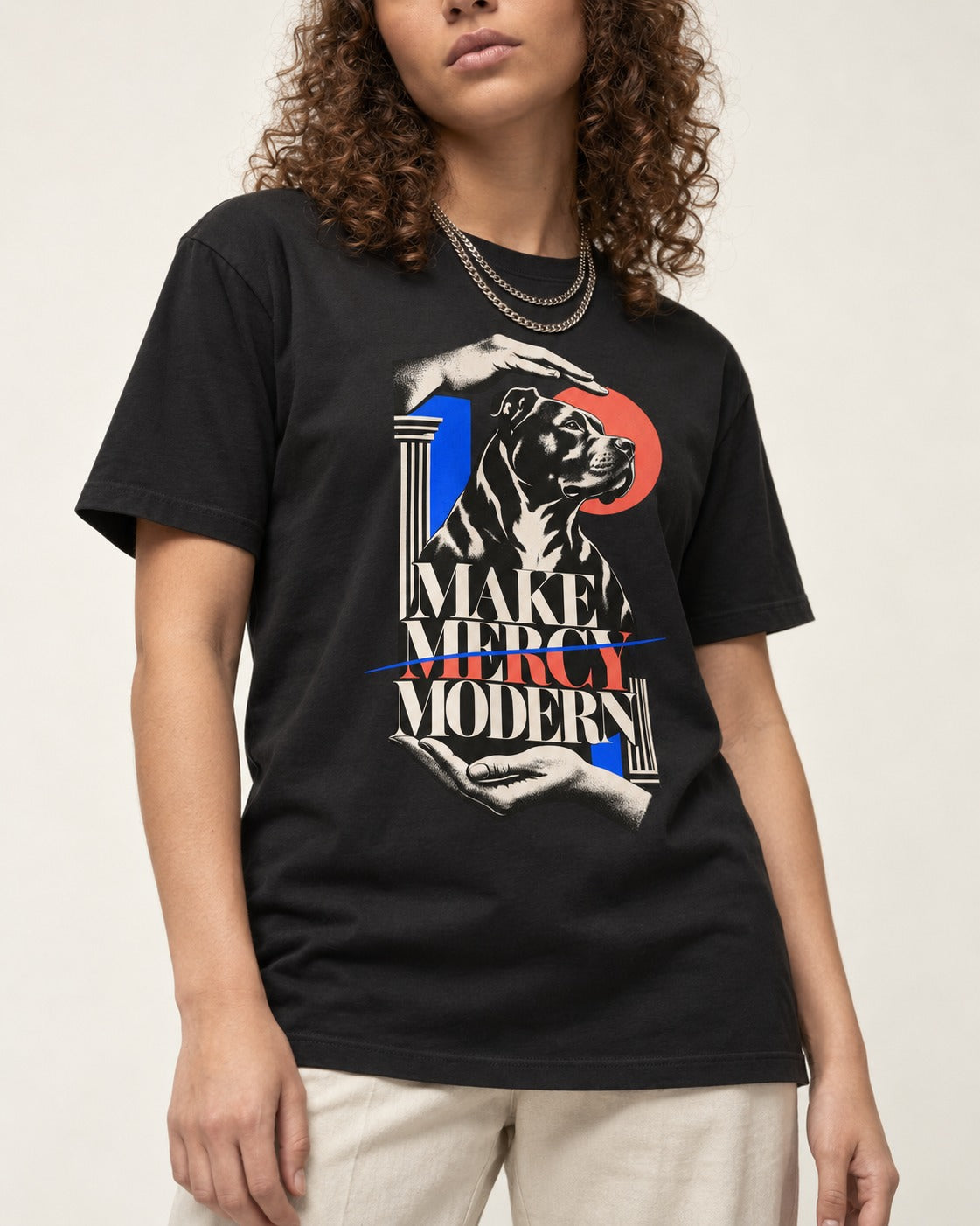 Pitbull Make Mercy Modern Protective Hands Graphic T-Shirt in Black, worn by a model, front view