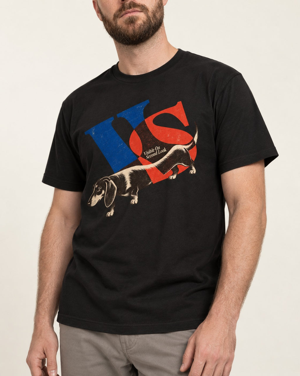 Dachshund VS Visible On Second Look Graphic T-Shirt in Black, worn by a model, front view
