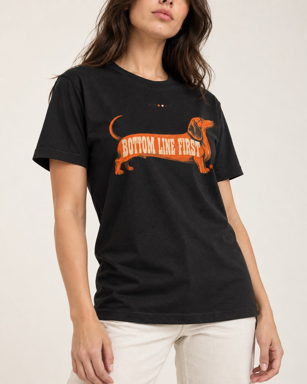 Dachshund Bottom Line First Body Lettering Graphic T-Shirt in Black, worn by a model, front view