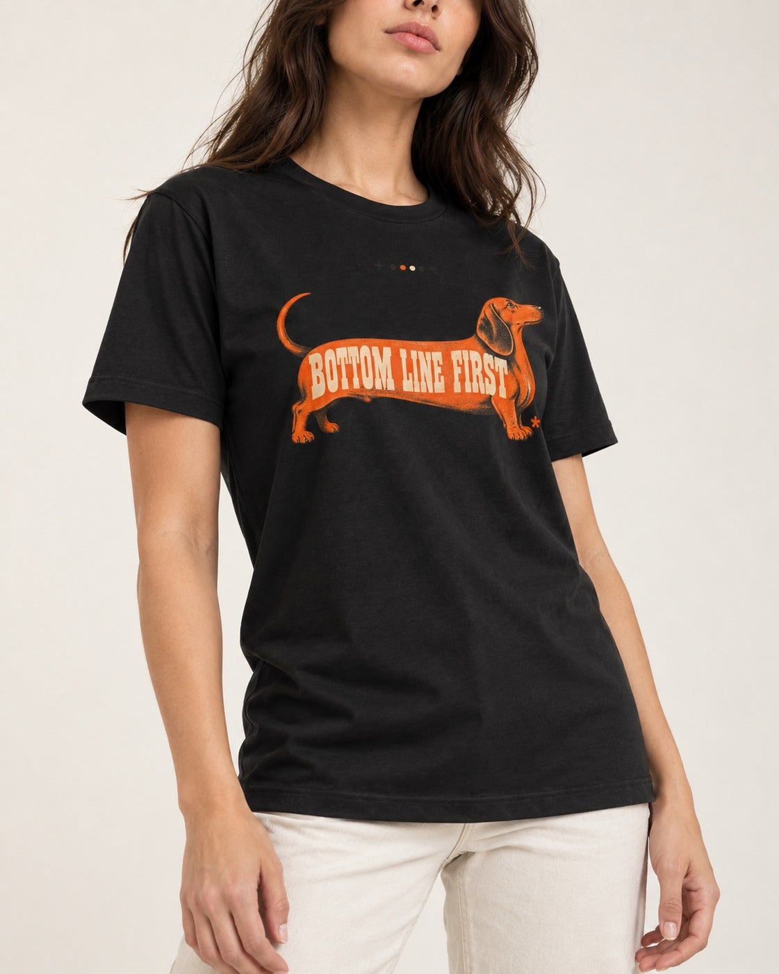Dachshund Bottom Line First Body Lettering Graphic T-Shirt in Black, worn by a model, front view