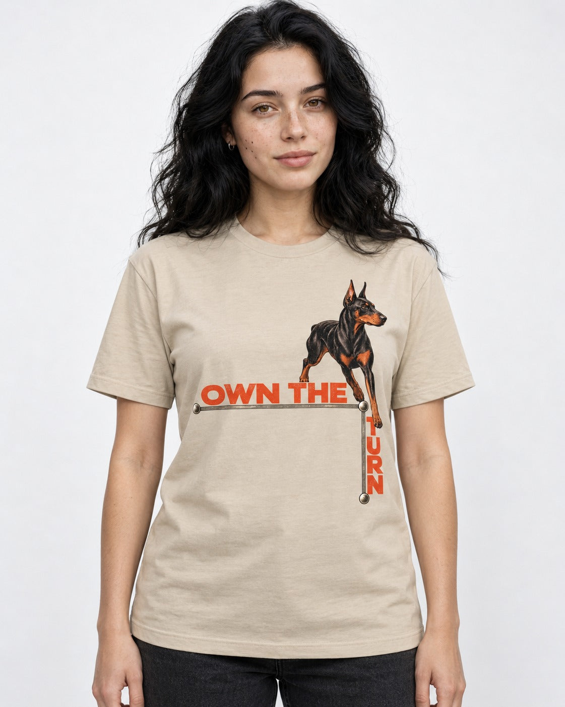 Own the Turn Doberman T-Shirt in Sand, worn by a model