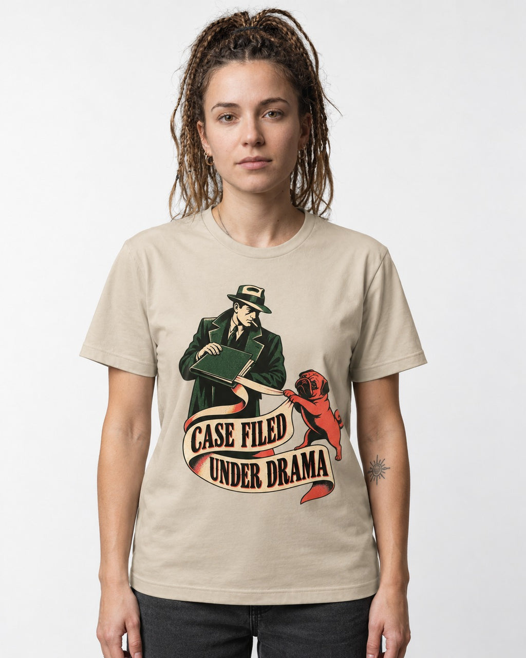 Pug Case Filed Under Drama T-Shirt in Sand, worn by a model
