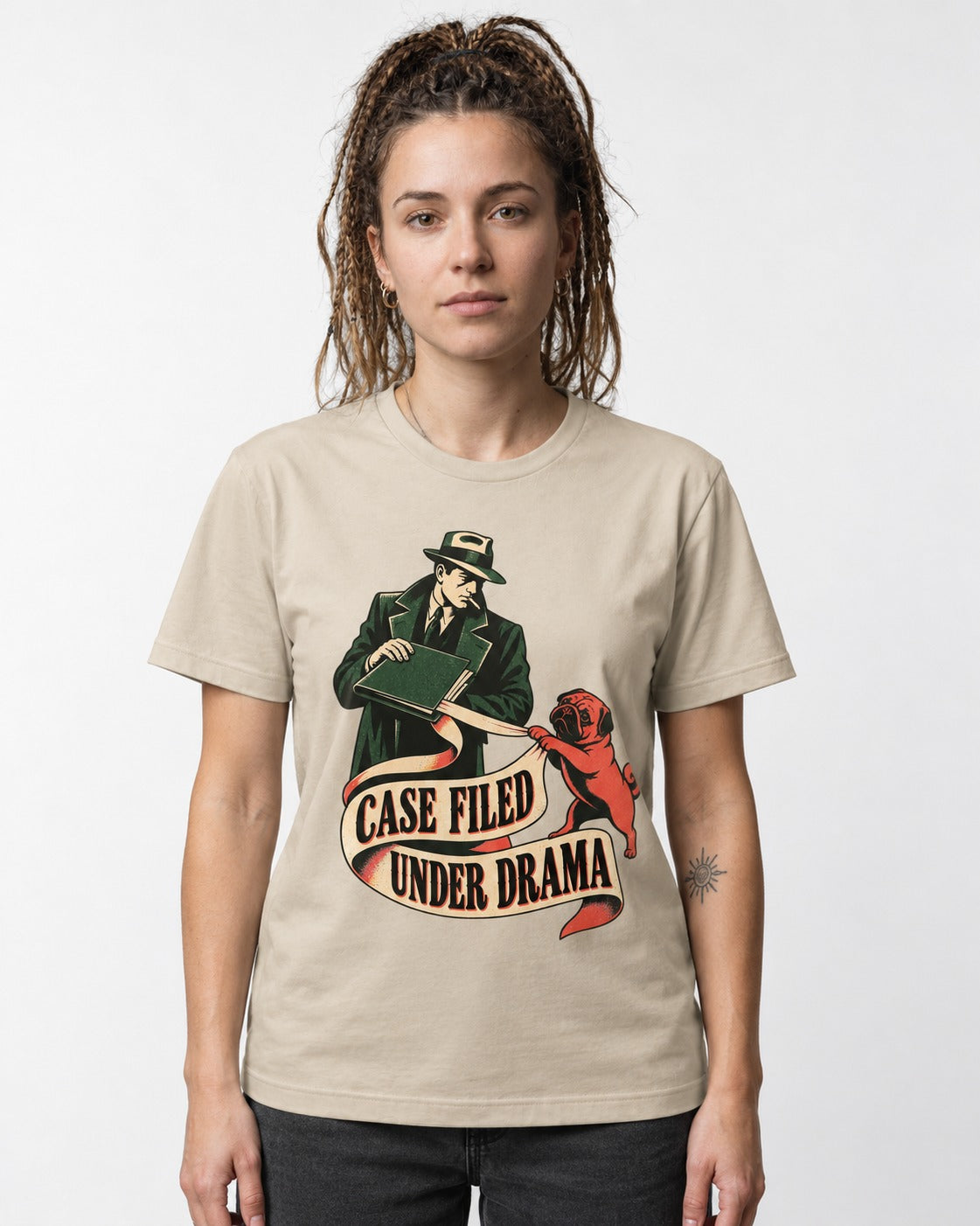 Pug Case Filed Under Drama T-Shirt in Sand, worn by a model