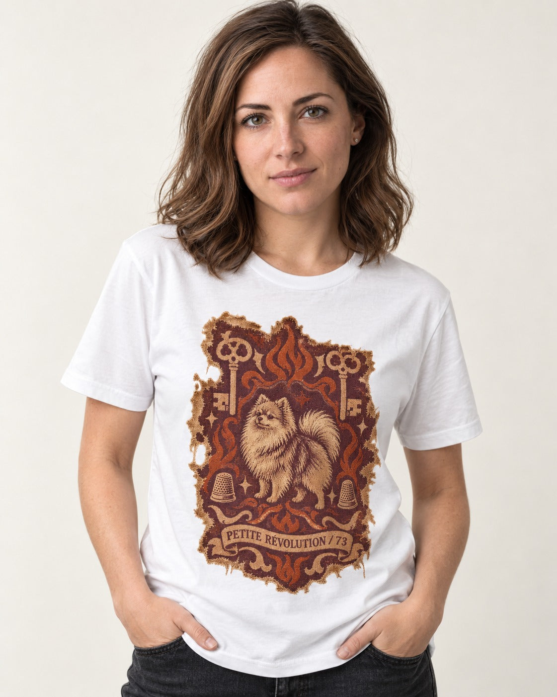 Pomeranian Petite Revolution Ornate Key Emblem Graphic T-Shirt in White, worn by a model
