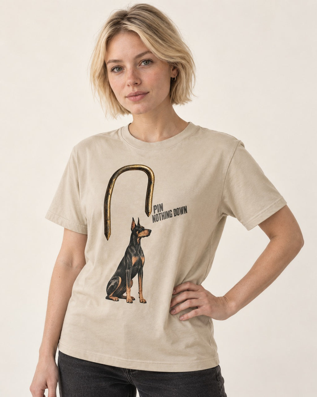 Nothing Pins Doberman Down T-Shirt in Sand, worn by a model