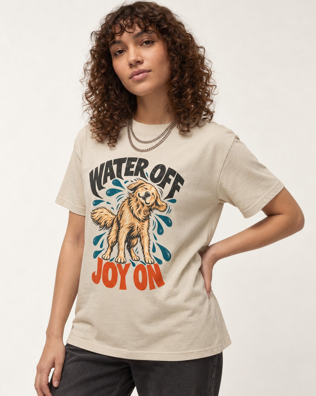 Water Off Joy on Golden Retriever T-Shirt in Sand, worn by a model