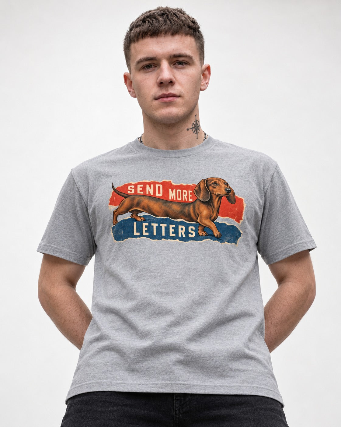 Dachshund Send More Letters Torn Paper Graphic T-Shirt in Sport Grey, worn by a model