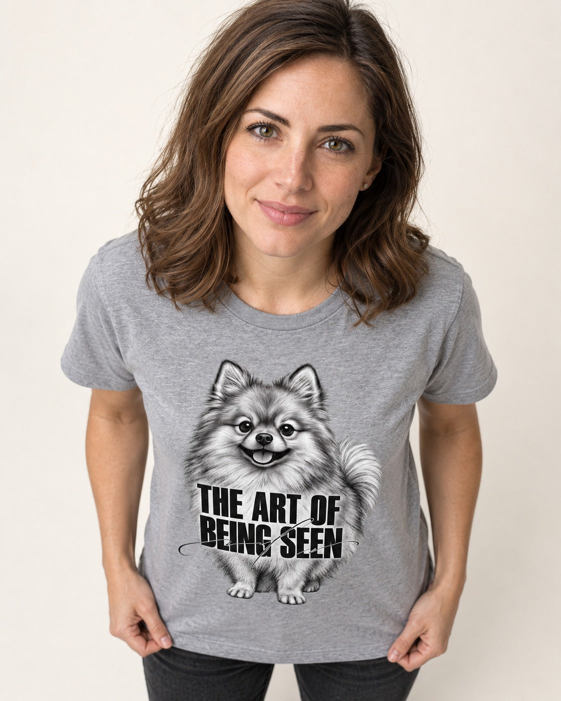Pomeranian The Art of Being Seen Portrait Graphic T-Shirt in Sport Grey, worn by a model