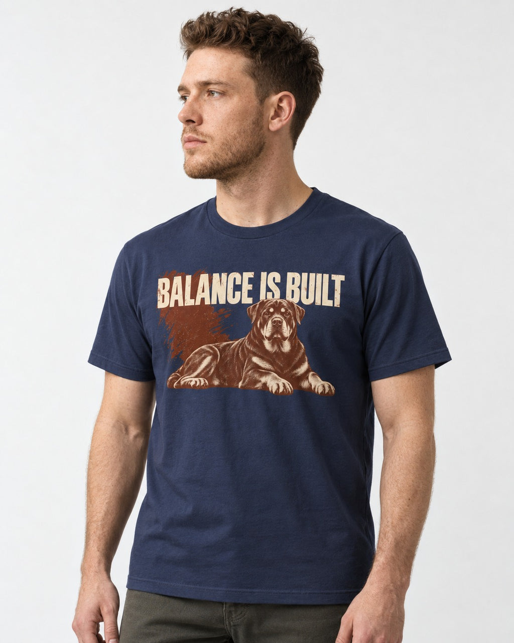 Rottweiler Balance Is Built Resting Strength Graphic T-Shirt in Navy, worn by a model
