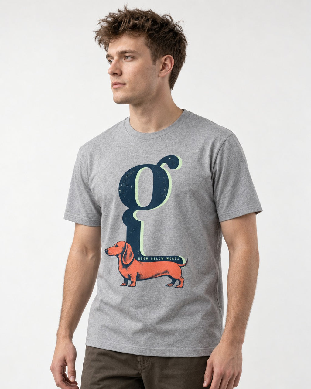 Dachshund Room Below Words Lowercase G Graphic T-Shirt in Sport Grey, worn by a model