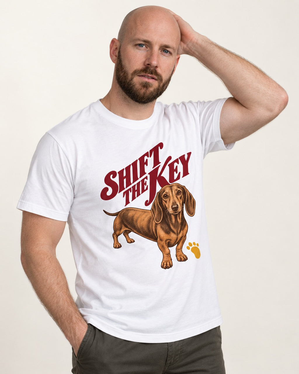 Dachshund Shift The Key Pawprint Graphic T-Shirt in White, worn by a model
