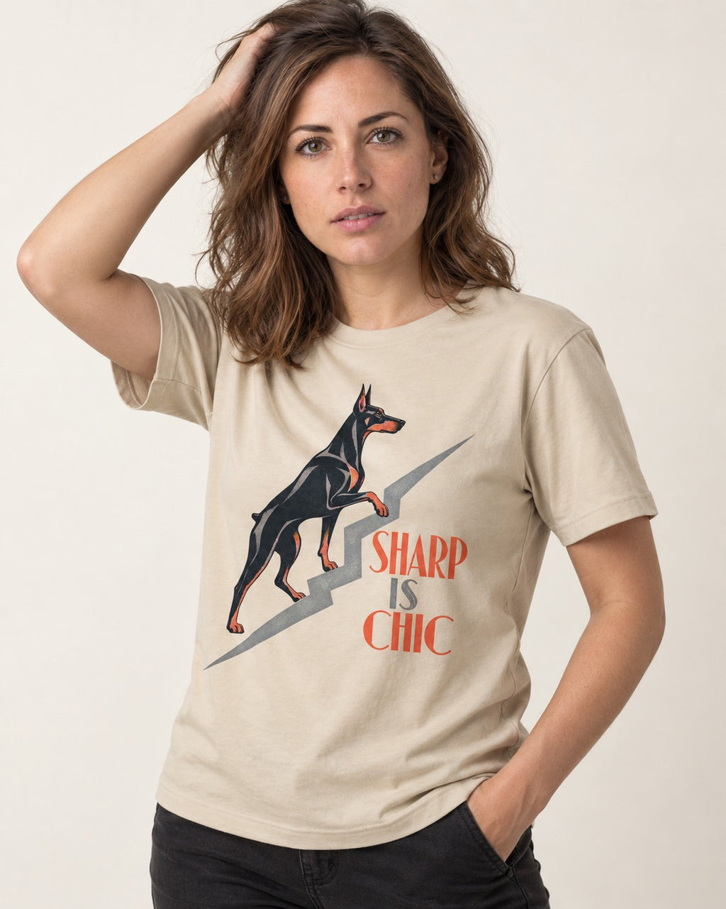 Doberman Is Chic T-Shirt in Sand, worn by a model