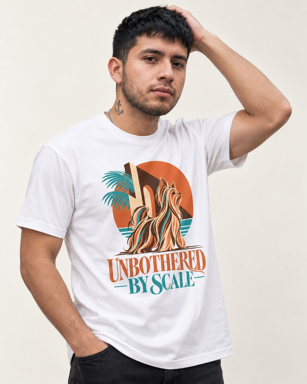 Yorkshire Terrier Unbothered by Scale Tropical Architecture Graphic T-Shirt in White, worn by a model