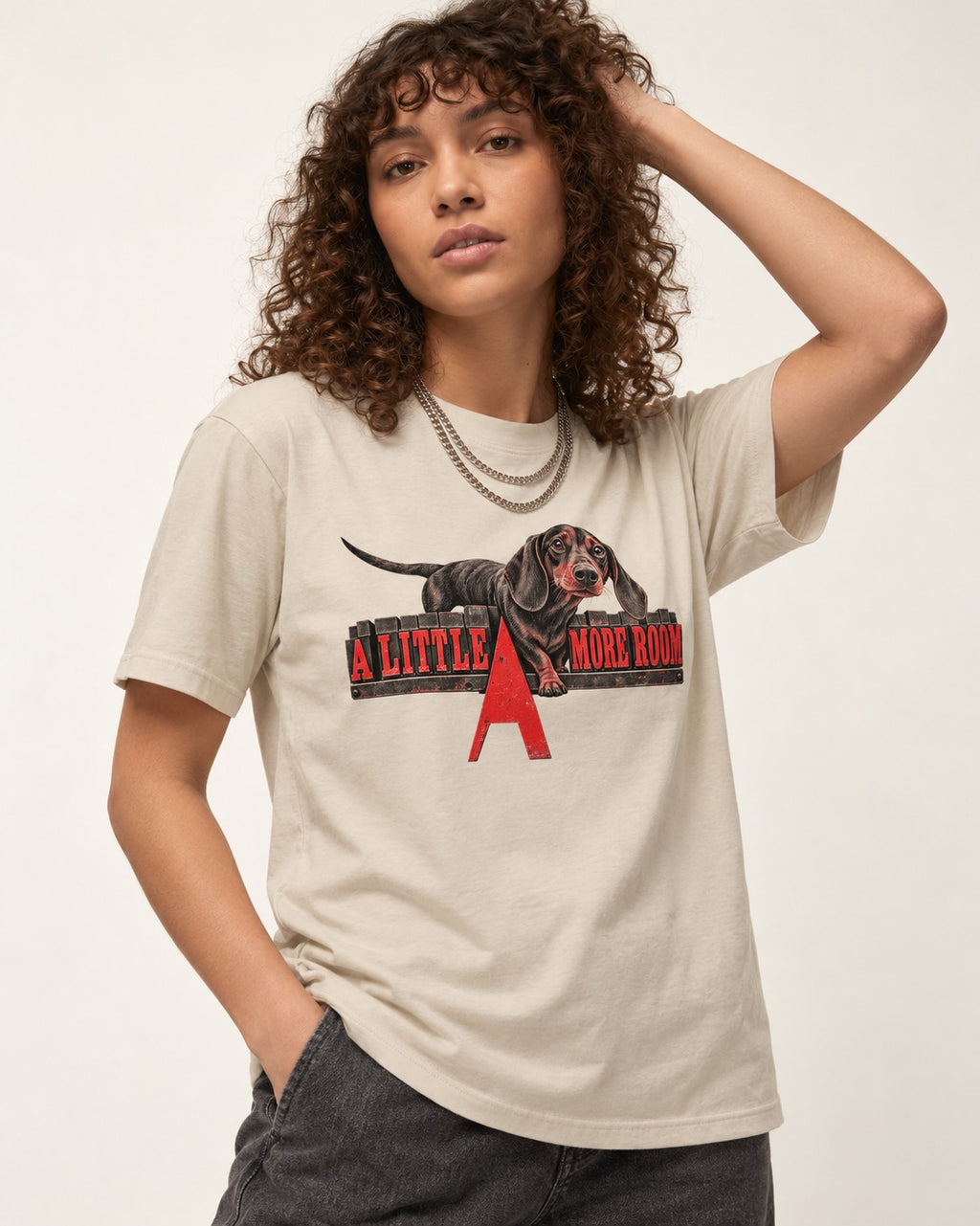 More Room for Dachshund T-Shirt in Sand, worn by a model